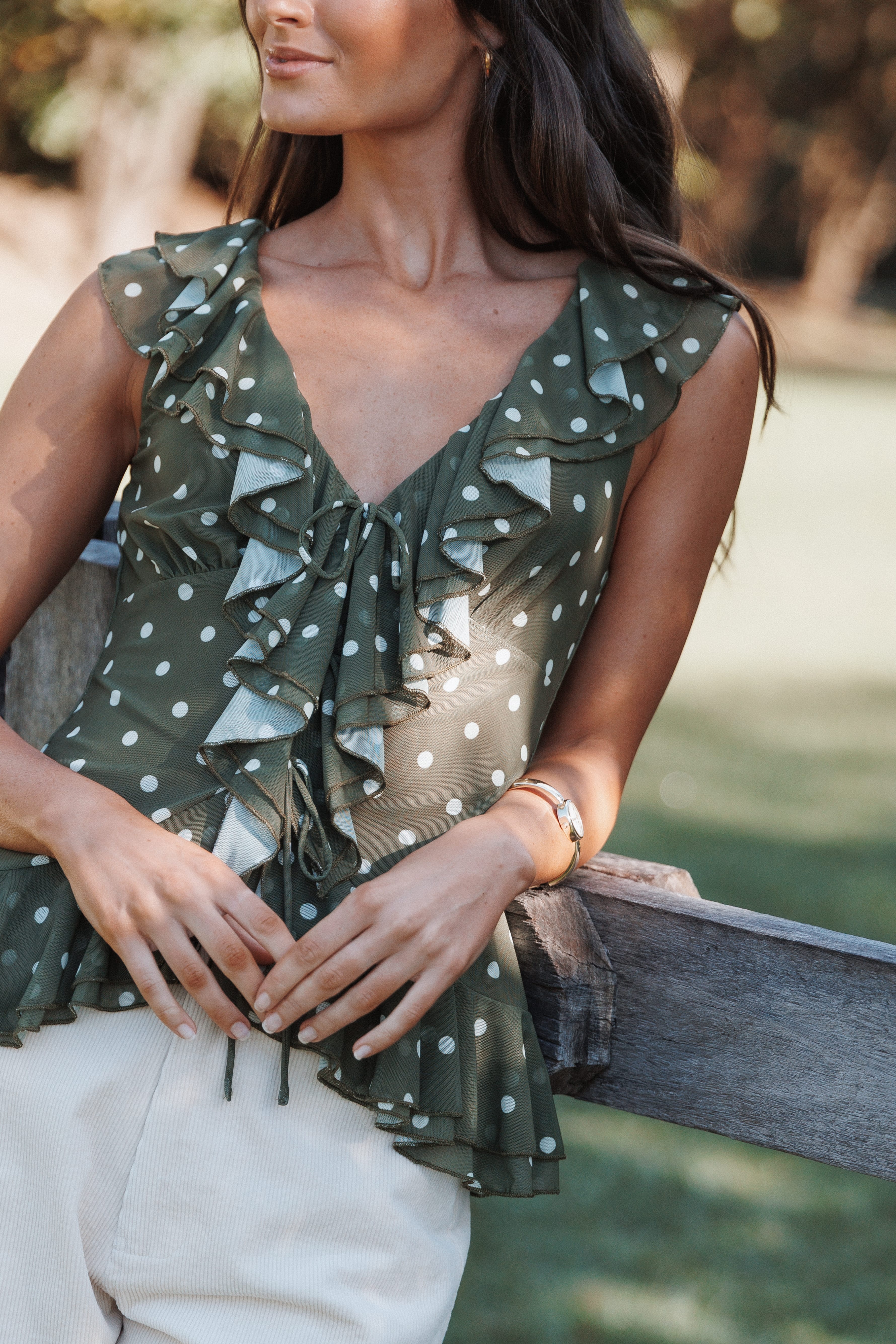 Orelia Ruffle Front Top - Olive Green Polka Dot