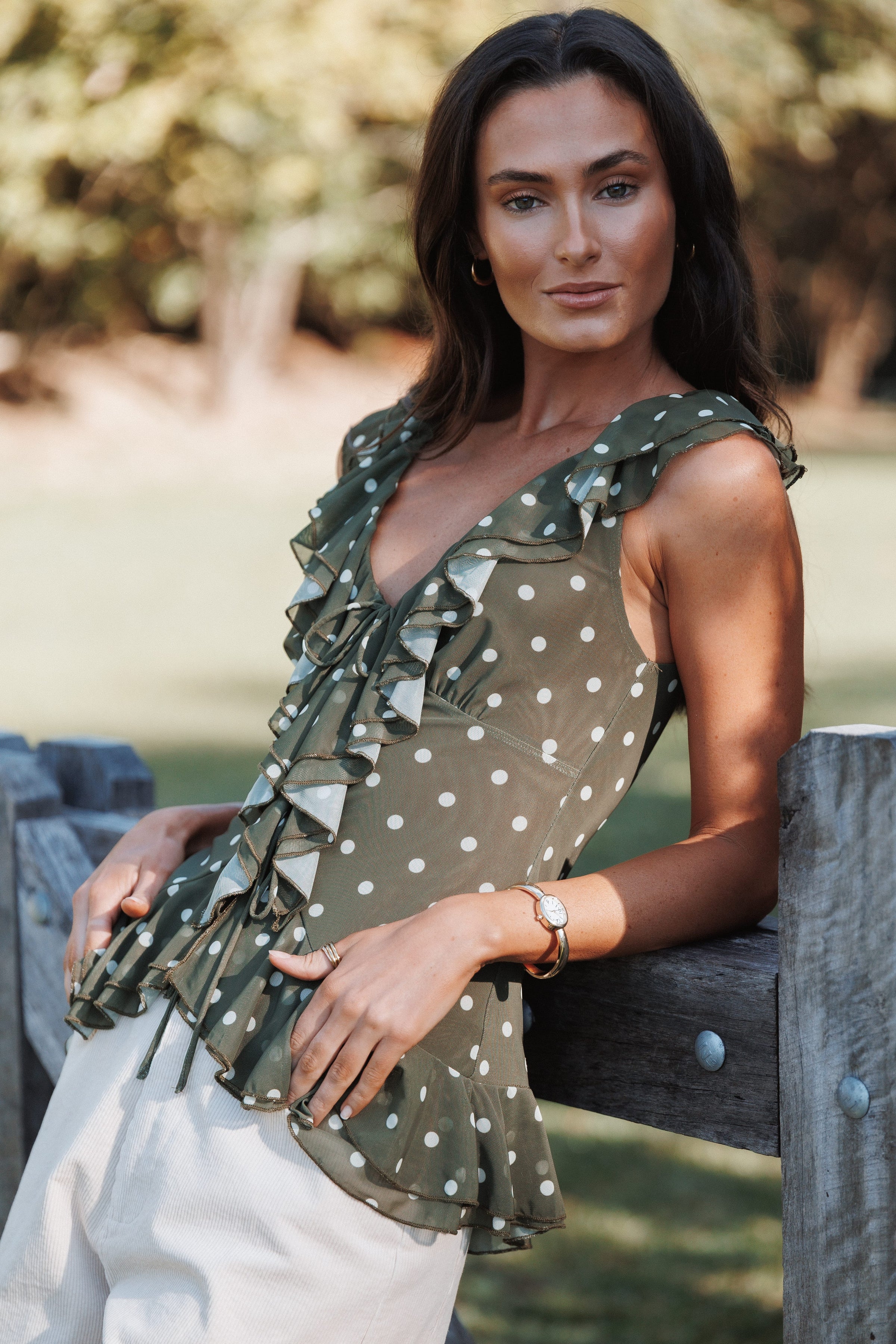 Orelia Ruffle Front Top - Olive Green Polka Dot