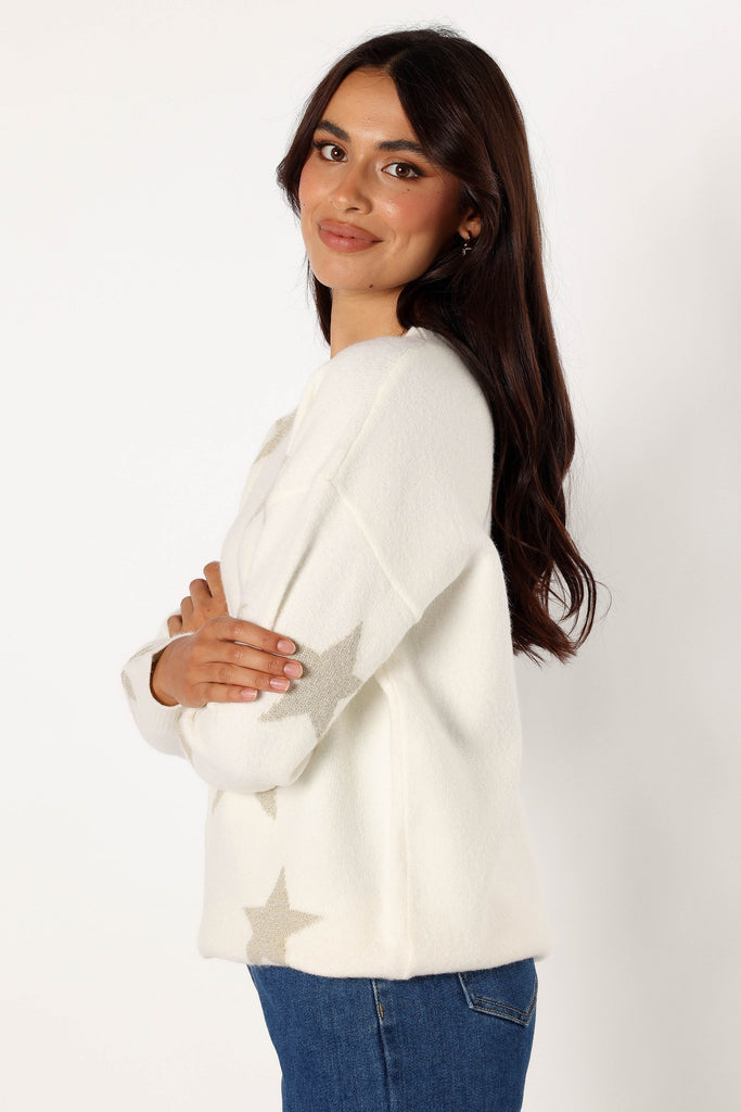 White sweater with clearance stars