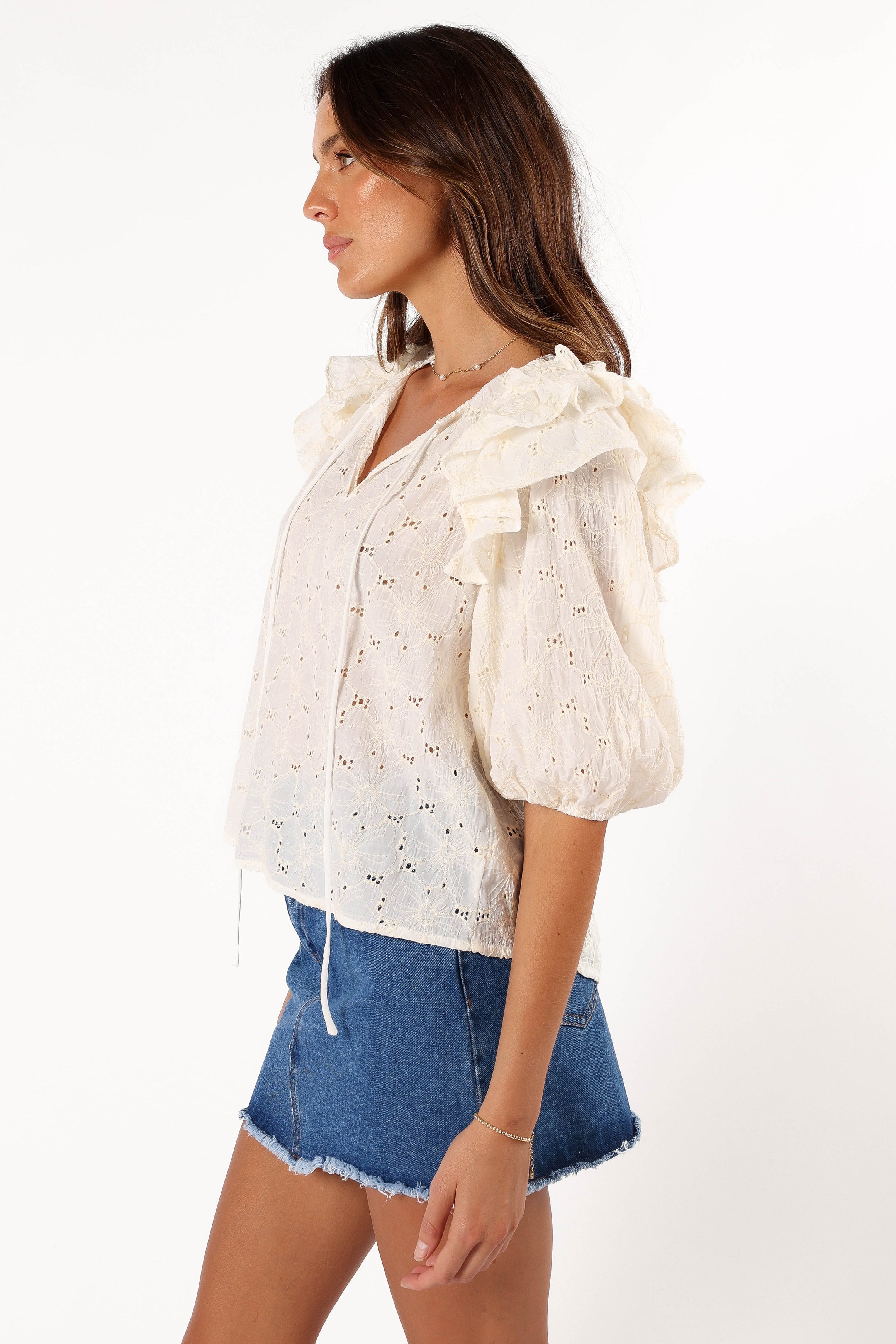 cream ruffle top